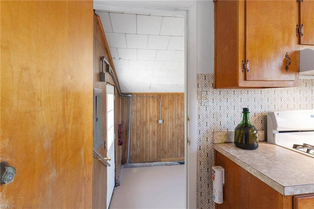 Kitchen leading to Utility room & backyard