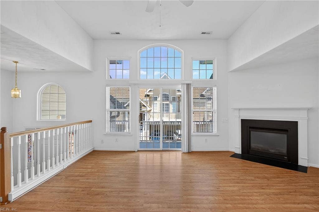3943 Filbert Way, Carriage Homes @ Towne Sq, Virginia Beach, VA 23462 Floor to ceiling windows, the balcony, and the gas fireplace provide light and comfort no matter the season.
