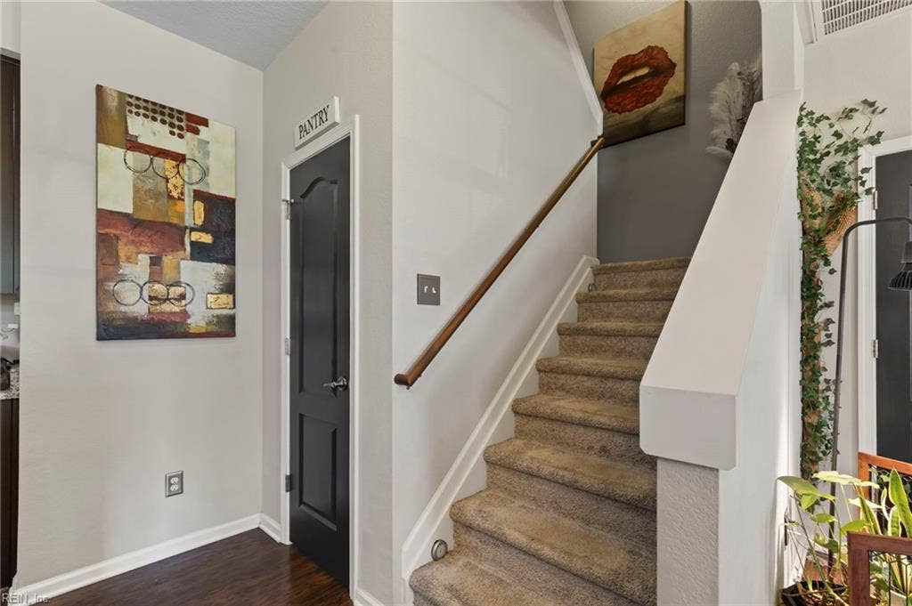 Pantry to the left of the stairs leading to level two.