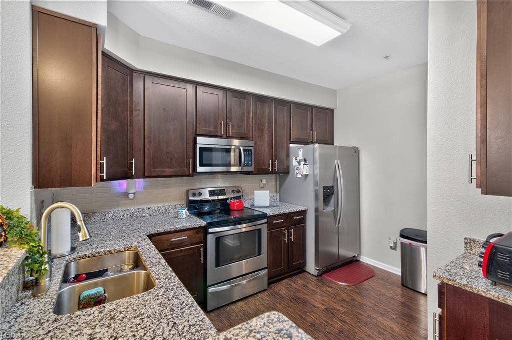 Kitchen with stainless steel appliances.