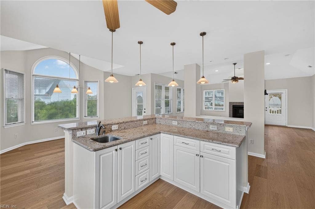 9570 Bay Point Drive, Bay Breeze Point, Norfolk, VA 23518 Big arched windows throughout this great home. Pendant lighting above the large island.