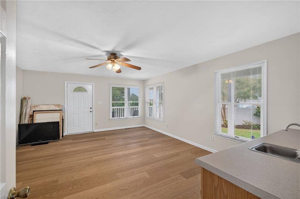 9570 Bay Point Drive, Bay Breeze Point, Norfolk, VA 23518 The in-law suite features more of the gleaming wood floors and built in counter, sink and room for a mini kitchen.