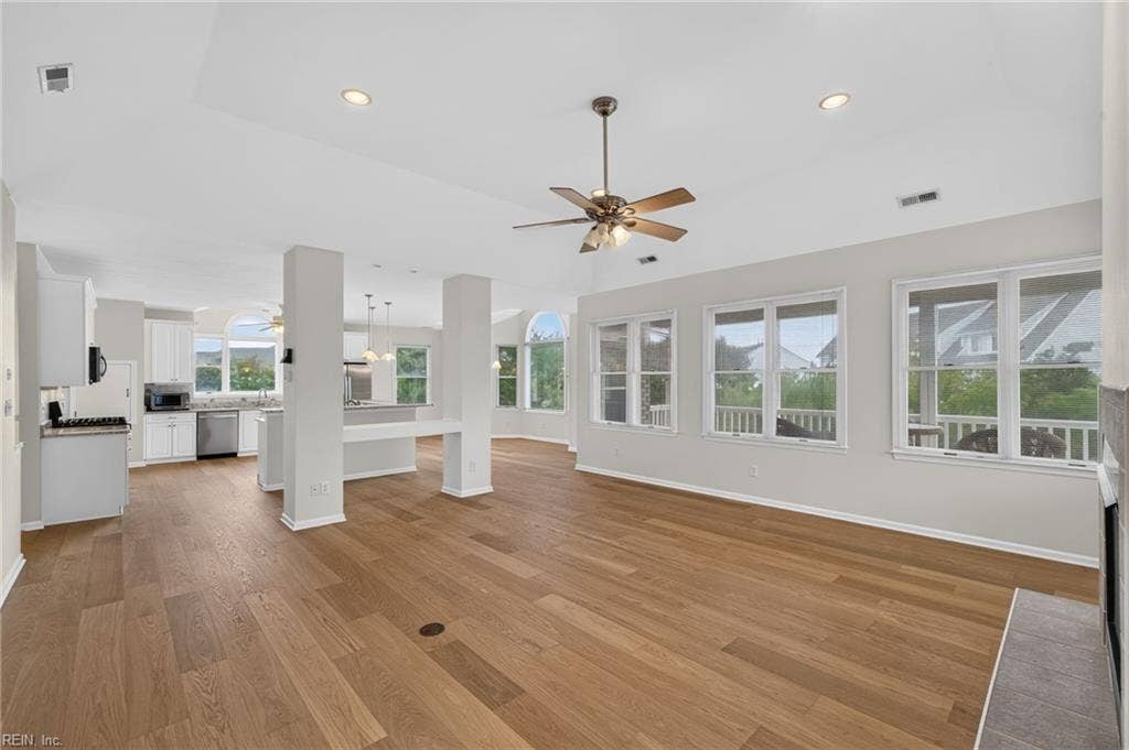 9570 Bay Point Drive, Bay Breeze Point, Norfolk, VA 23518 Gleaming wood floors are a wonderful upgrade. This entire living space is so light and airy.