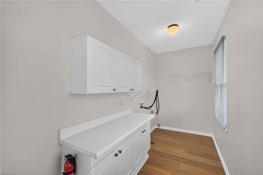 9570 Bay Point Drive, Bay Breeze Point, Norfolk, VA 23518 Adjacent to the kitchen, the laundry room features built in cabinetry to make laundry an ease.