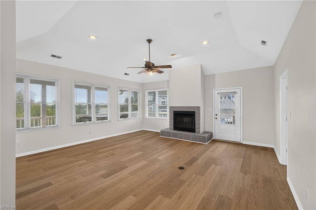 9570 Bay Point Drive, Bay Breeze Point, Norfolk, VA 23518 Gather friends and family to enjoy beach living. The gas fireplace makes a lovely focal point.
