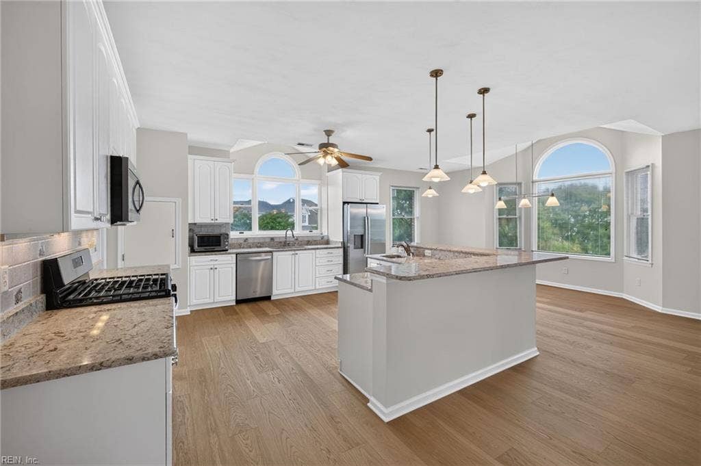 9570 Bay Point Drive, Bay Breeze Point, Norfolk, VA 23518 Gleaming granite counters with a generous island and newer stainless appliances.