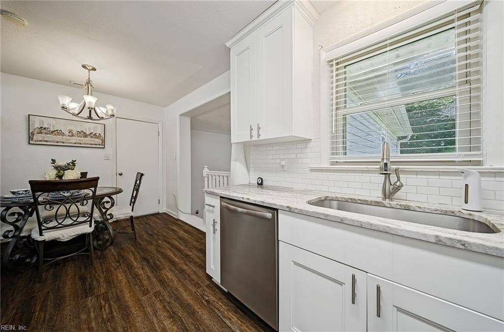 granite counters, newer kitchen cabinets, stainless steel appliances