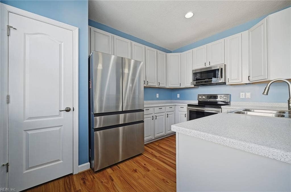 4804 Almandine Avenue, Virginia Beach, VA 23462 SOFT CLOSE WOOD CABINETS, PANTRY, BLACK HARDWARE, CORIAN COUNTER TOP , STAINLESS STEEL APPLIANCES AND BREAKFAST BAR!