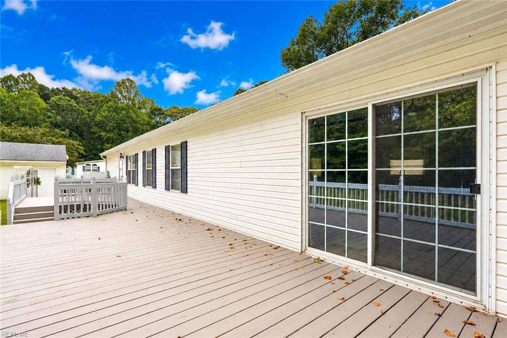 Recently painted back deck, siliding doors to family room