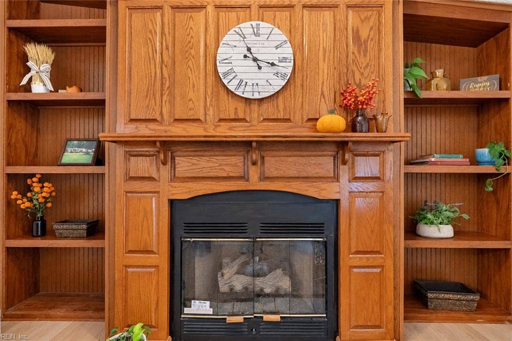 Propane gas fireplace with built in book cases adding fuction and style