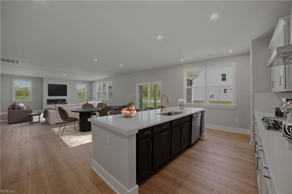 1405 Wharf Hill Drive, Mallory Pointe, Smithfield, VA 23430 * Kitchen into Family Room - Photos are virtually staged