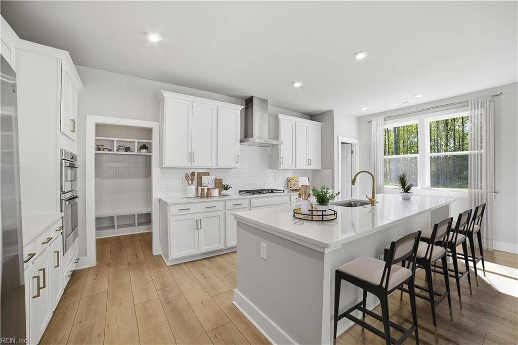 1402 Wharf Hill Drive, Mallory Pointe, Smithfield, VA 23430 * Kitchen into Pantry / Garage- Photos are virtually staged