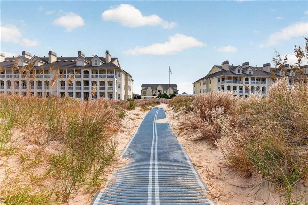 Dune walkway mat leading from the Lesner Pointe community to the Chesapeake Bay beach in Chic's Beach, Virginia Beach. Residents walk past the pool to reach the sand. Beach access comes with this first-floor 3 bedroom condo. 23451.