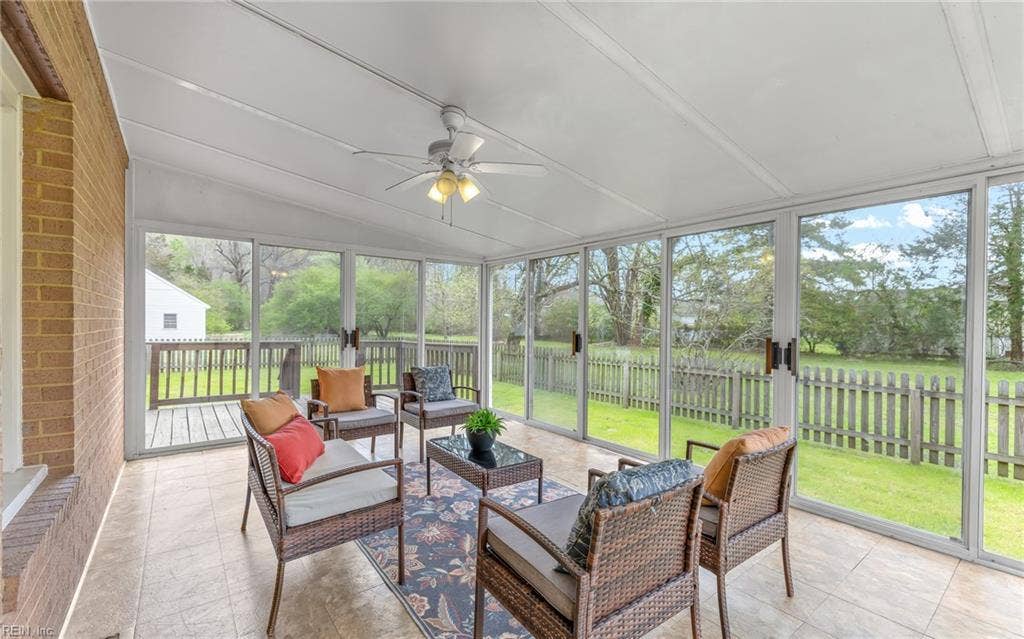 317 George Washington Highway S, Chesapeake, VA 23323 The large sunroom extends the living space outdoors and creates a comfortable place to enjoy the yard in multiple seasons.