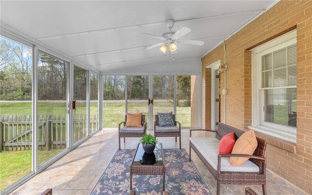317 George Washington Highway S, Chesapeake, VA 23323 A bright, enclosed outdoor living area adds another place to relax, gather or simply enjoy the view.