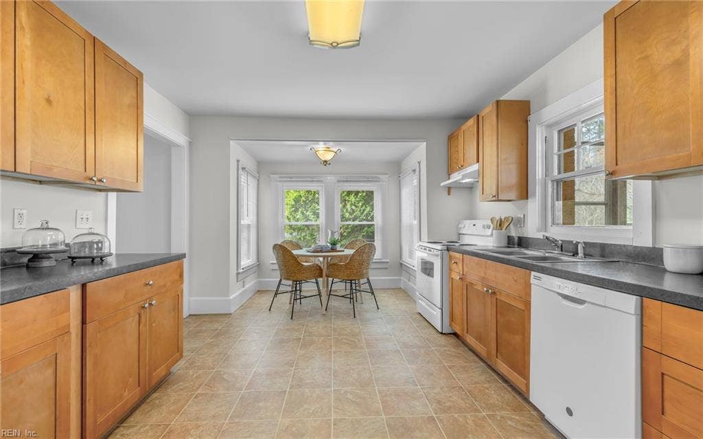 317 George Washington Highway S, Chesapeake, VA 23323 The kitchen opens to a sunny breakfast area, adding casual dining space without sacrificing prep or storage room.