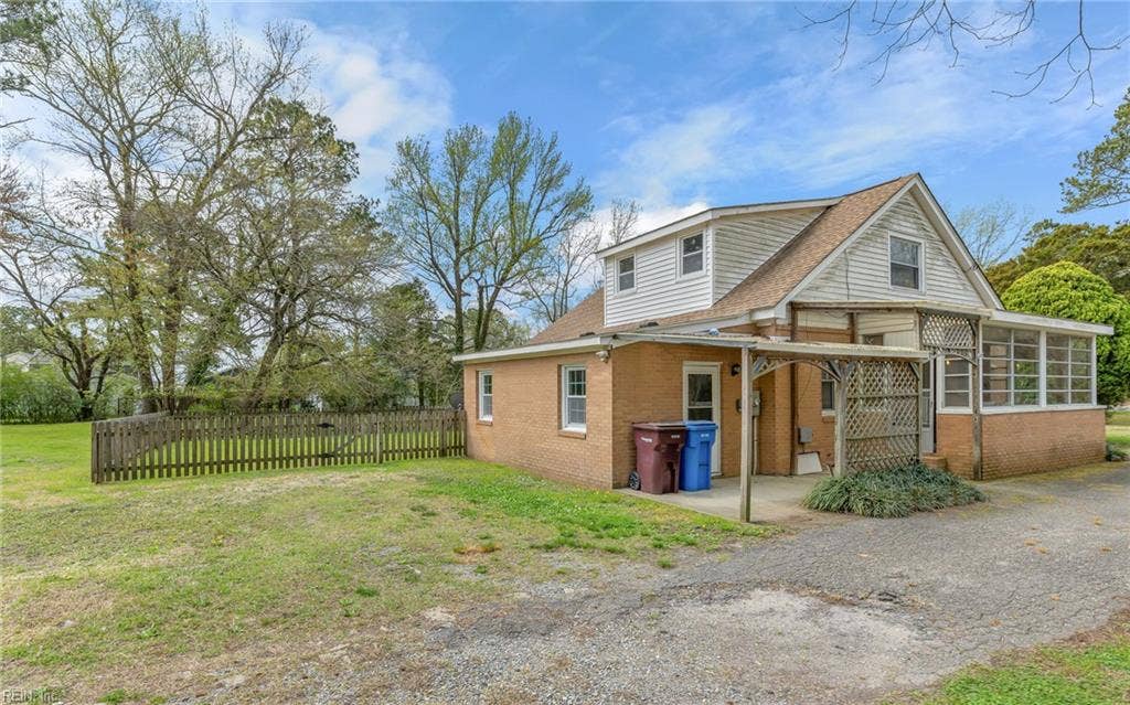 317 George Washington Highway S, Chesapeake, VA 23323 The fenced yard gives you a more contained outdoor area while the rest of the acreage extends beyond it.
