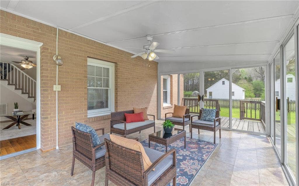 317 George Washington Highway S, Chesapeake, VA 23323 With plenty of room for seating, the sunroom offers an easy connection between the home and the outdoor settin