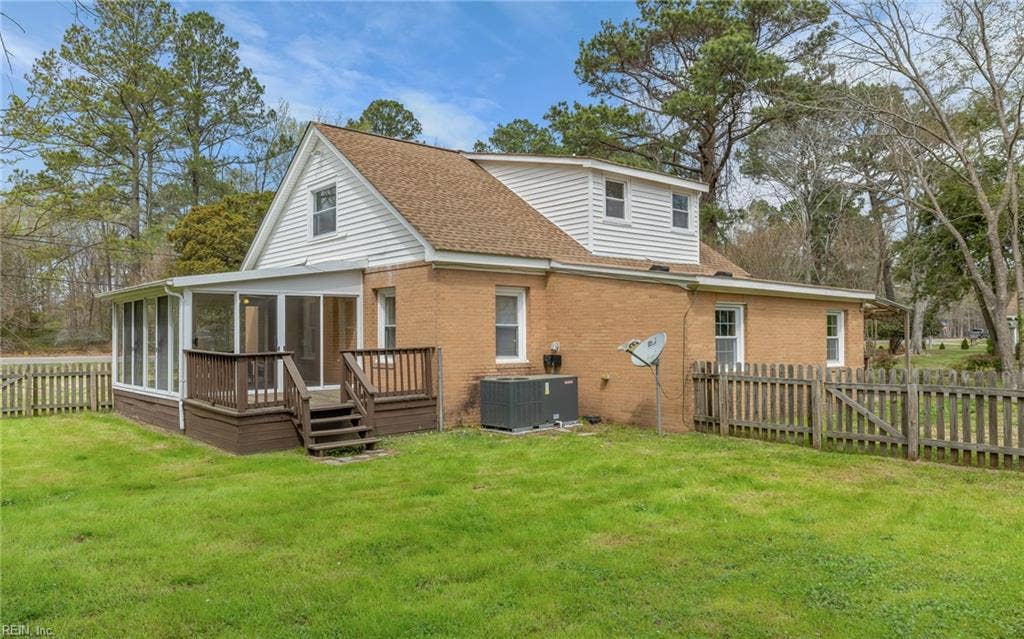 317 George Washington Highway S, Chesapeake, VA 23323 The deck creates an easy outdoor living space just off the house, overlooking the fenced yard with the larger acreage beyond.