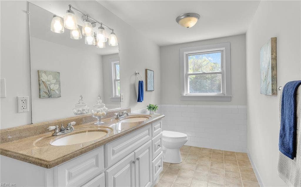 317 George Washington Highway S, Chesapeake, VA 23323 The updated upstairs bath features a double vanity, abundant natural light and useful counter space.