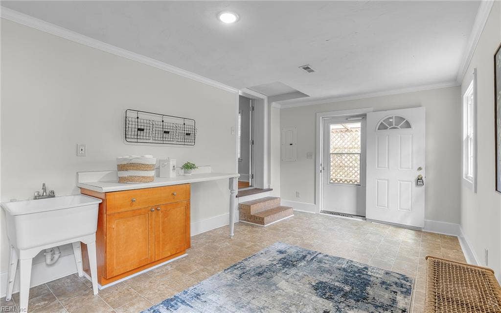 317 George Washington Highway S, Chesapeake, VA 23323 Utility sink, storage and direct exterior access make this a useful transition space between indoors and out. Washer and Dryer not pictured, but included!