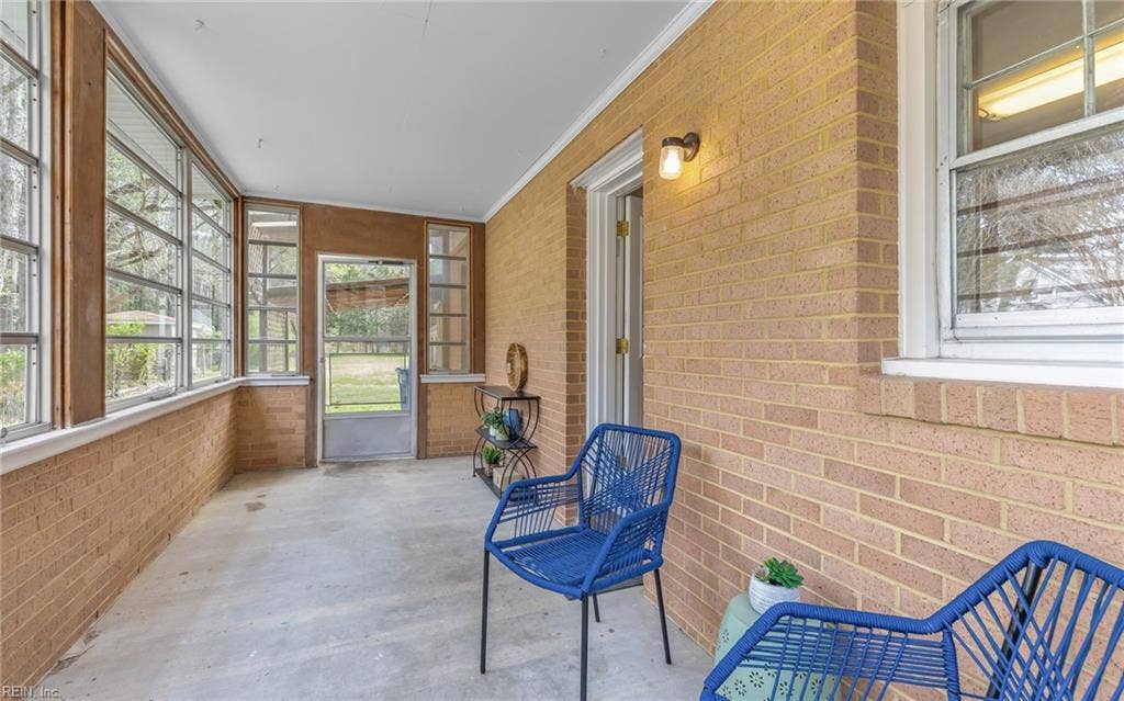 317 George Washington Highway S, Chesapeake, VA 23323 An additional enclosed porch adds even more usable space and another charming and functional transition point between the home and yard.