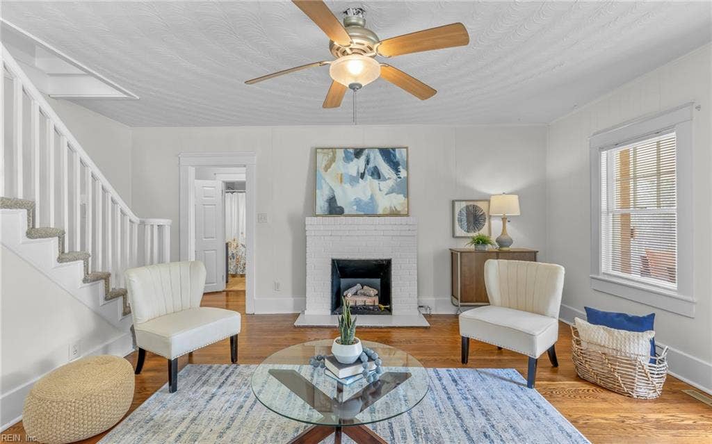 317 George Washington Highway S, Chesapeake, VA 23323 The fireplace anchors the living room while the hardwood floors add warmth and character.
