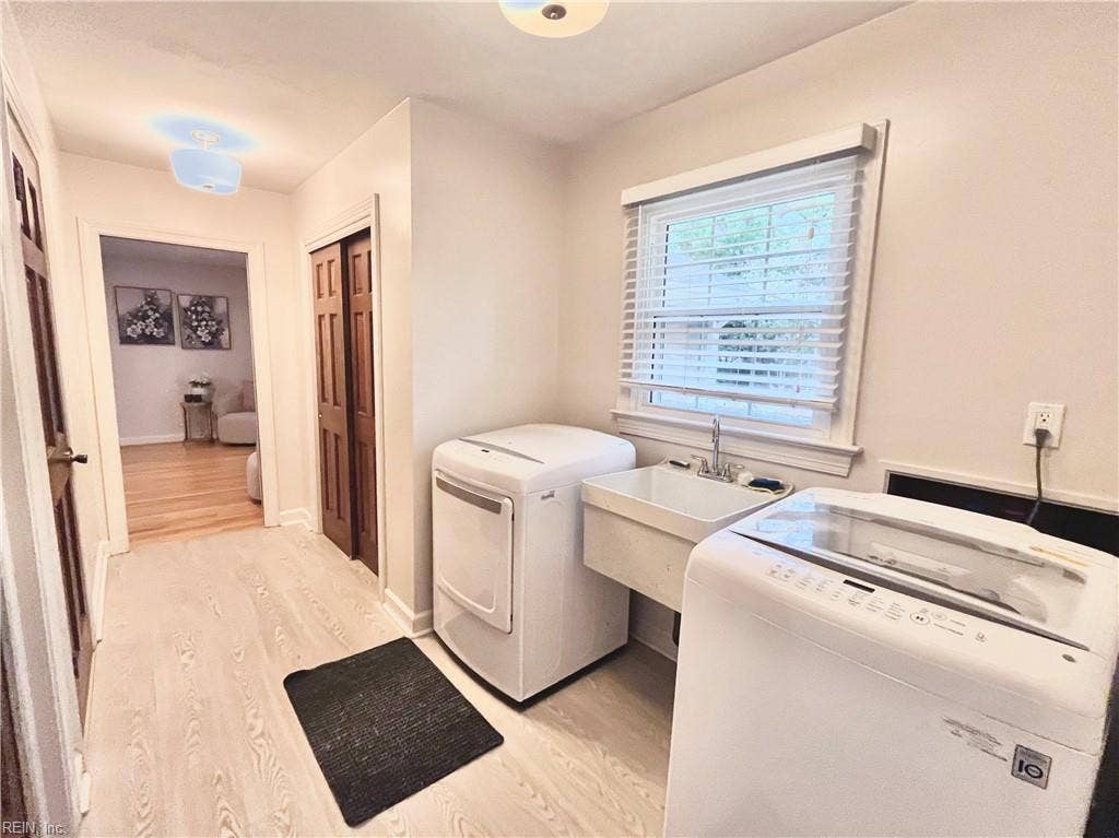 Laundry room with utility sink.