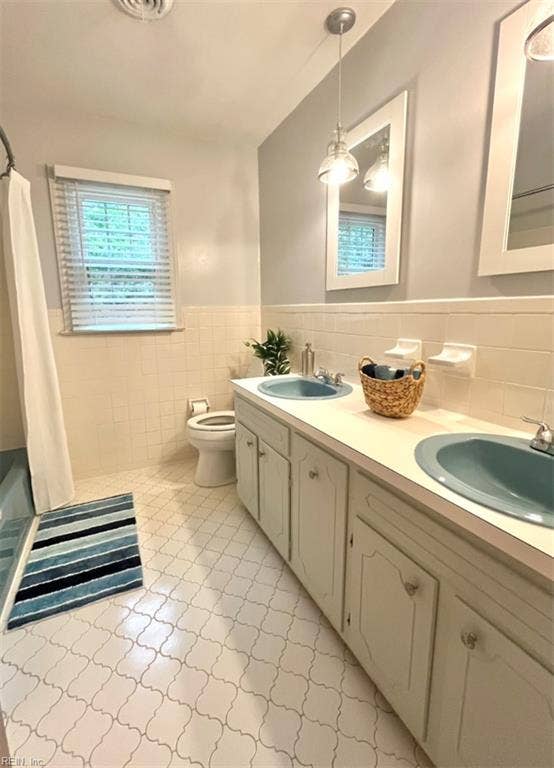 Upstairs full bath in hall.
