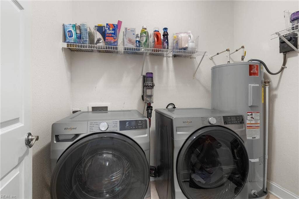 2309 Valle Rio Way, Virginia Beach, VA 23456 Dedicated downstairs laundry room with plenty of storage and a Whirlpool front-load washer and electric dryer, both conveying with the home.
