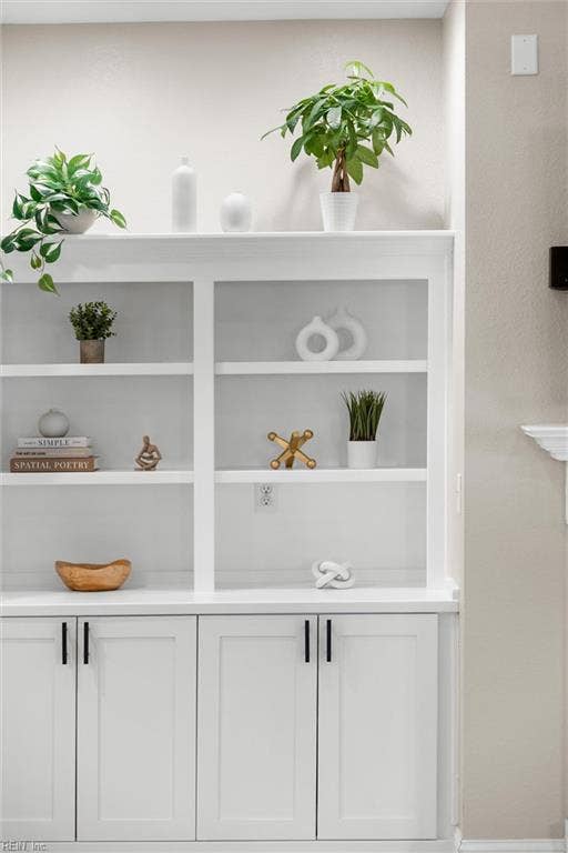 2309 Valle Rio Way, Virginia Beach, VA 23456 Custom built-ins combine display shelves with concealed storage, keeping everyday essentials close at hand.