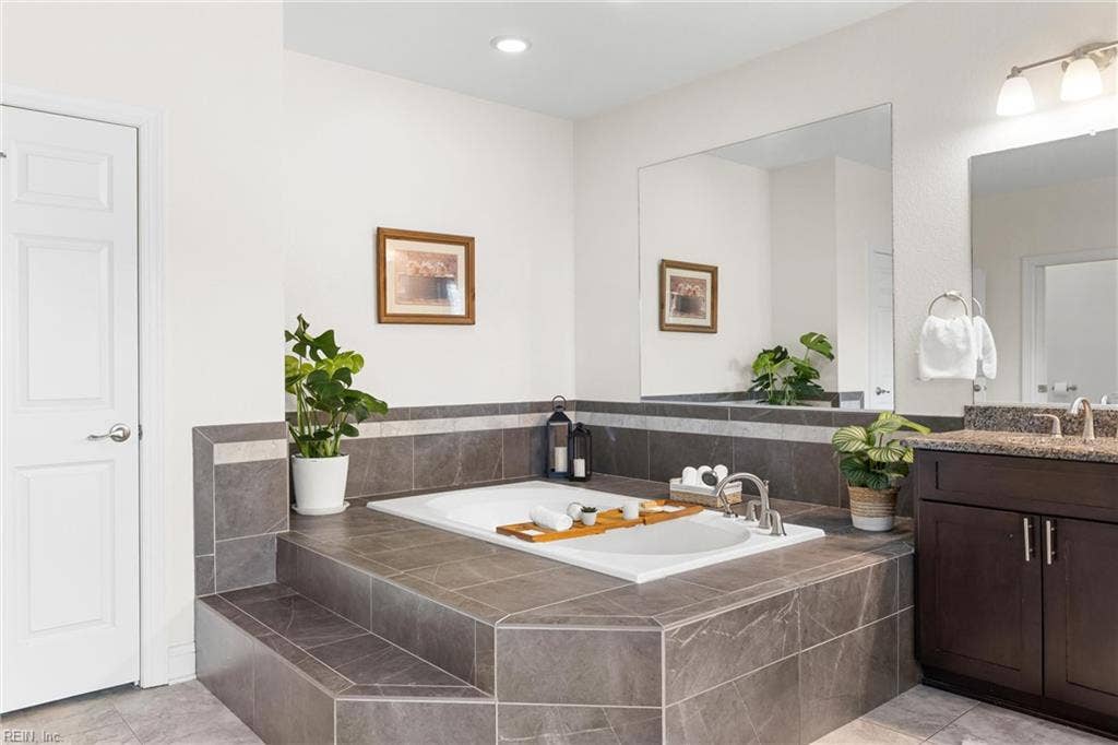 2309 Valle Rio Way, Virginia Beach, VA 23456 A separate soaking tub, walk-in shower, and double vanity create a spacious private retreat.