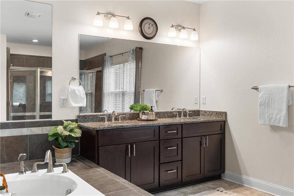 2309 Valle Rio Way, Virginia Beach, VA 23456 A granite-topped double vanity provides separate sinks, generous counter space, and concealed storage.