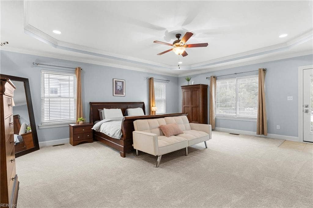 2309 Valle Rio Way, Virginia Beach, VA 23456 A spacious main-level primary suite features a tray ceiling, new carpet, and room for a separate sitting area.