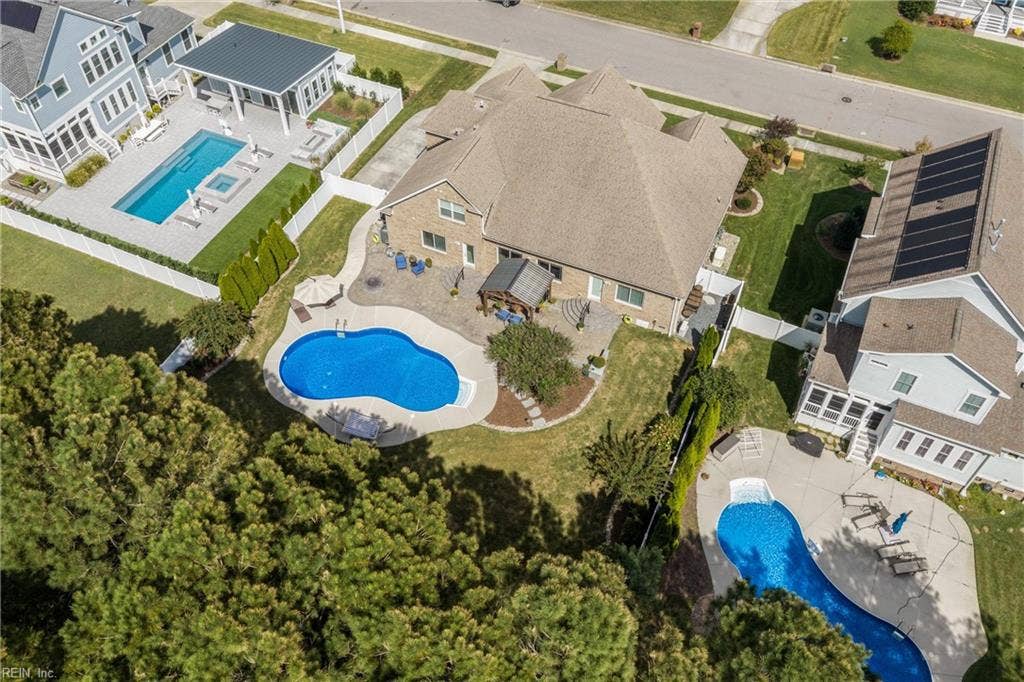 2309 Valle Rio Way, Virginia Beach, VA 23456 See how the pool, patios, fencing, and wooded backdrop come together to create this outdoor retreat.