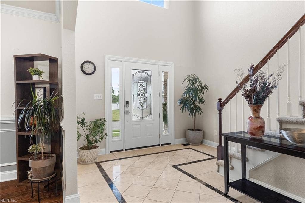 2309 Valle Rio Way, Virginia Beach, VA 23456 A bright, two-story foyer features marble flooring & opens to a beautiful sightline through the home toward the backyard.