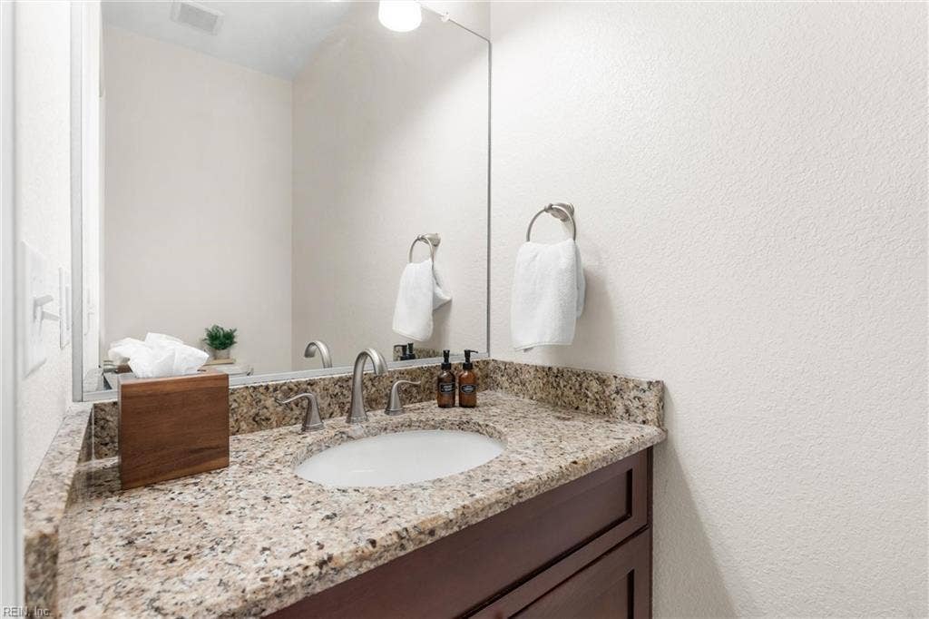 2309 Valle Rio Way, Virginia Beach, VA 23456 A downstairs powder room gives guests a convenient bathroom without entering private bedroom spaces.