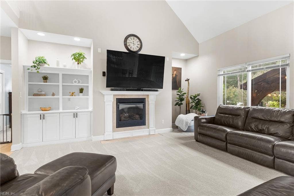 2309 Valle Rio Way, Virginia Beach, VA 23456 A gas fireplace and built-in cabinetry bring warmth, character and practical storage to the main living area.