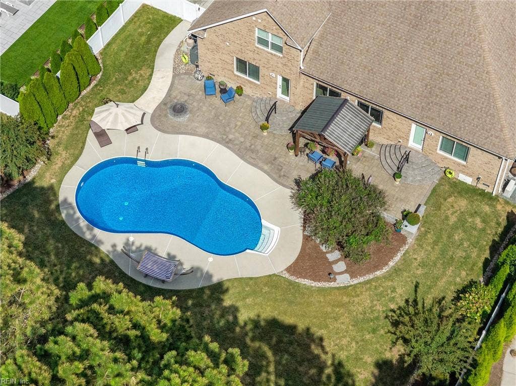 2309 Valle Rio Way, Virginia Beach, VA 23456 Professionally maintained lawn & landscaping surrounds the pool, with a nine-zone irrigation system supporting the grounds.