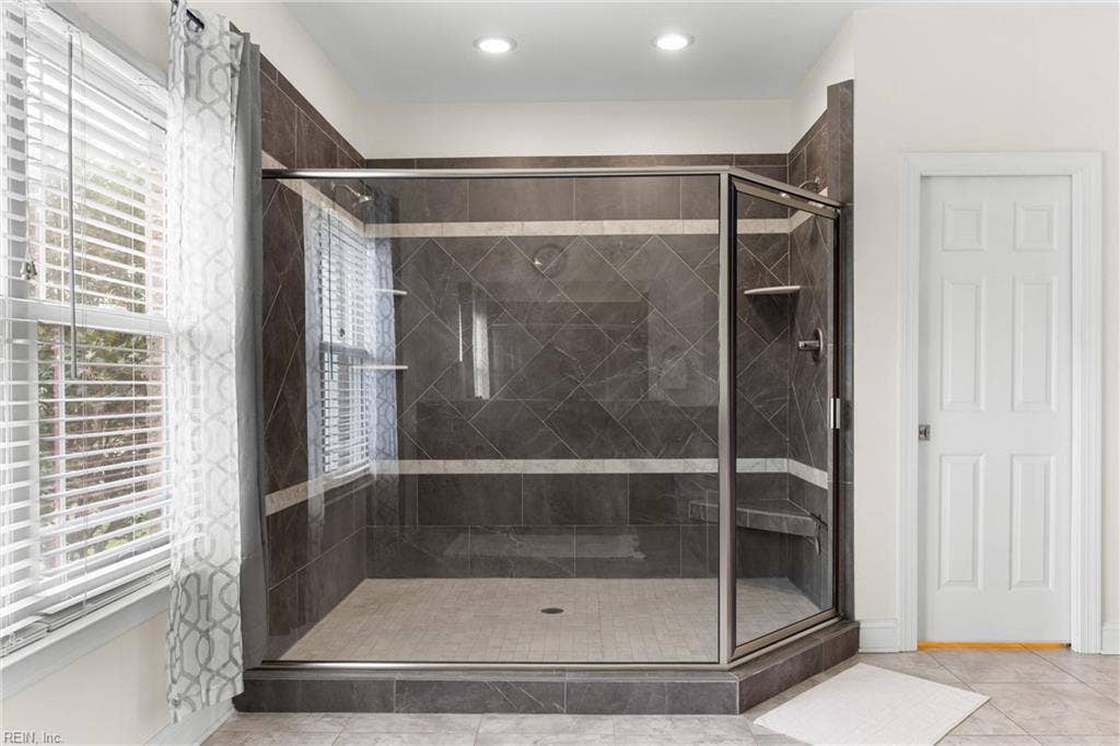 2309 Valle Rio Way, Virginia Beach, VA 23456 The spacious tiled shower features dual showerheads and a glass enclosure.