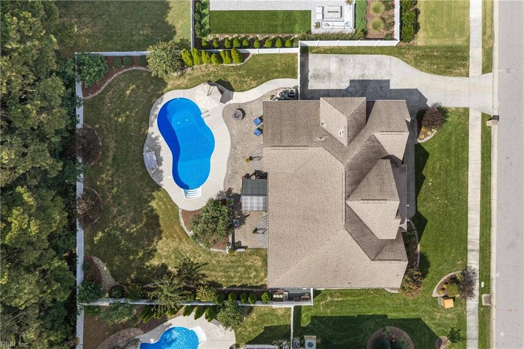 2309 Valle Rio Way, Virginia Beach, VA 23456 A 0.344-acre lot brings together a private pool, landscaped grounds, and multiple outdoor gathering areas.