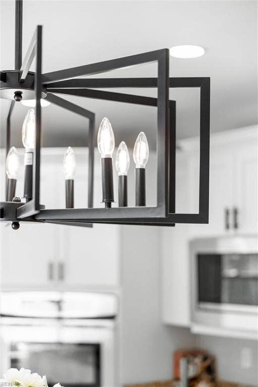2309 Valle Rio Way, Virginia Beach, VA 23456 Updated statement lighting adds a modern finishing touch above the kitchen’s gathering space.