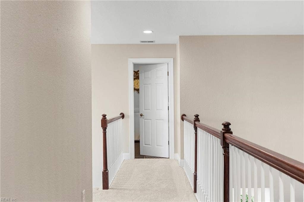 2309 Valle Rio Way, Virginia Beach, VA 23456 An open staircase and decorative railing preserve the home’s bright, airy feeling between levels.