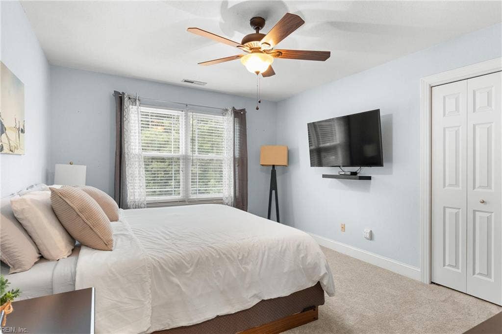 2309 Valle Rio Way, Virginia Beach, VA 23456 An upstairs bedroom with new carpet, natural light and separation from the main-level primary suite.