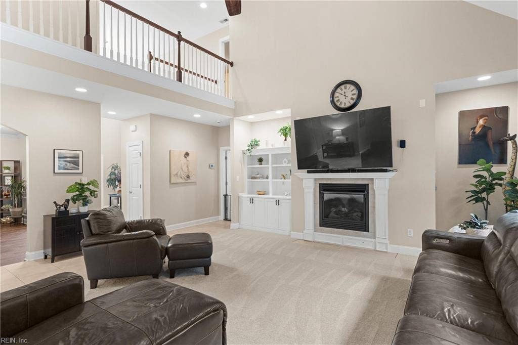 2309 Valle Rio Way, Virginia Beach, VA 23456 Soaring ceilings, an abundance of natural light and a gas fireplace anchor this spacious living area.