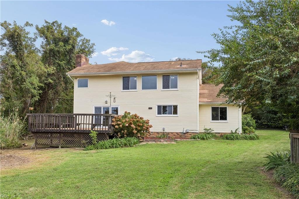 BACK OF THE HOME WITH LARGE BACK YARD