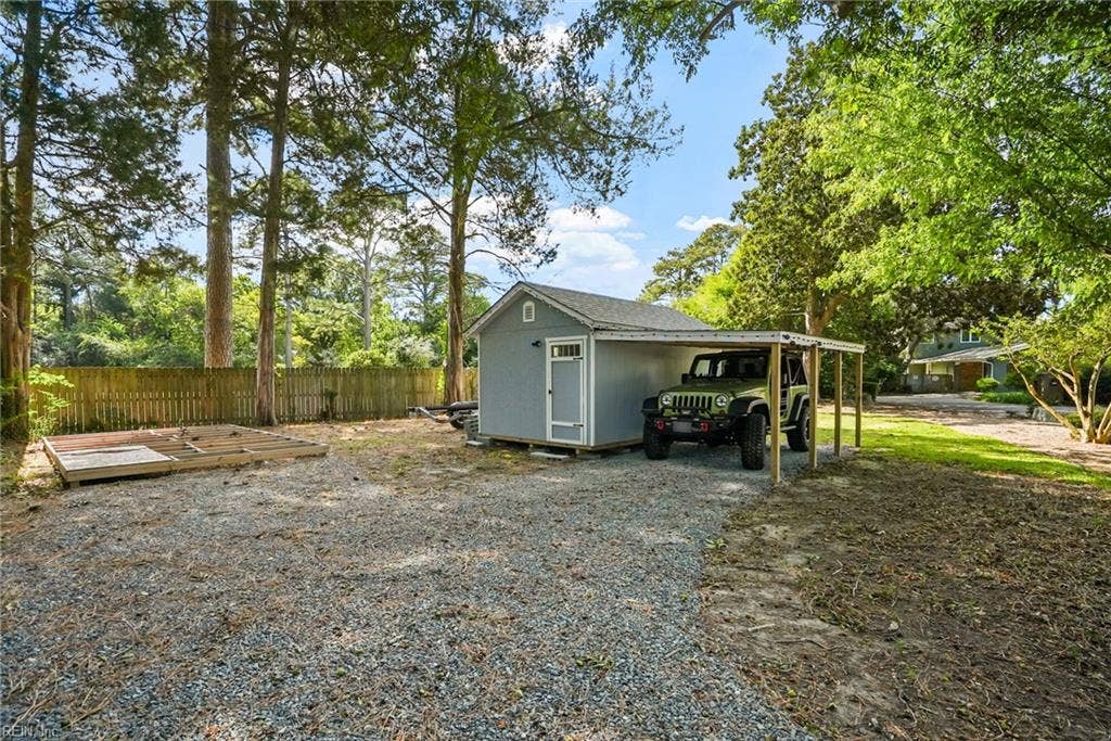 2031 Ridge End Road, Virginia Beach, VA 23454 gravel driveway and shed with carport