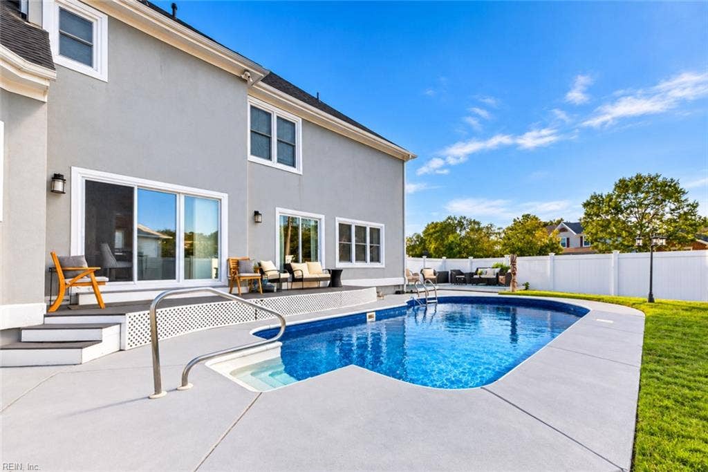 In-ground pool and expansive patio create the perfect outdoor escape