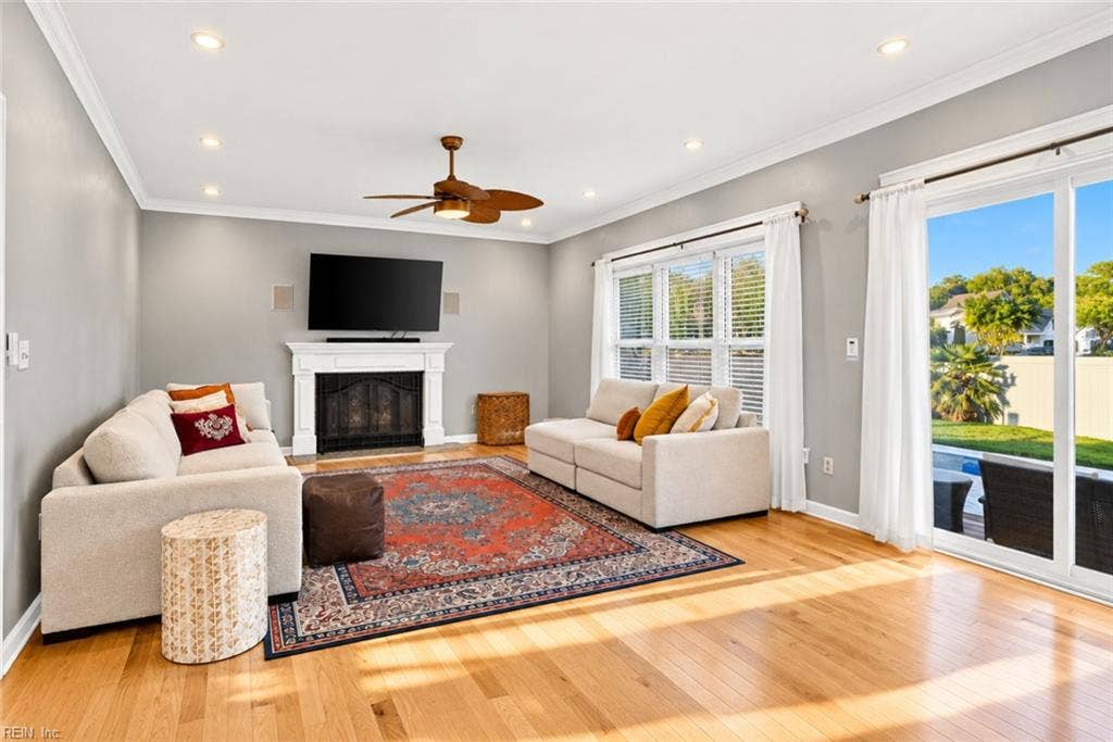 Light-filled family room with easy access to the backyard. Featuring two sliding glass doors for easy access to the pool.