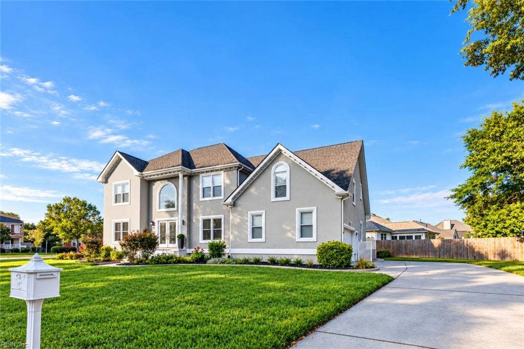 Impressive curb appeal, manicured lawn and timeless architecture and plenty of room for parking.